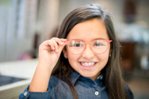 Girl Trying on Glasses